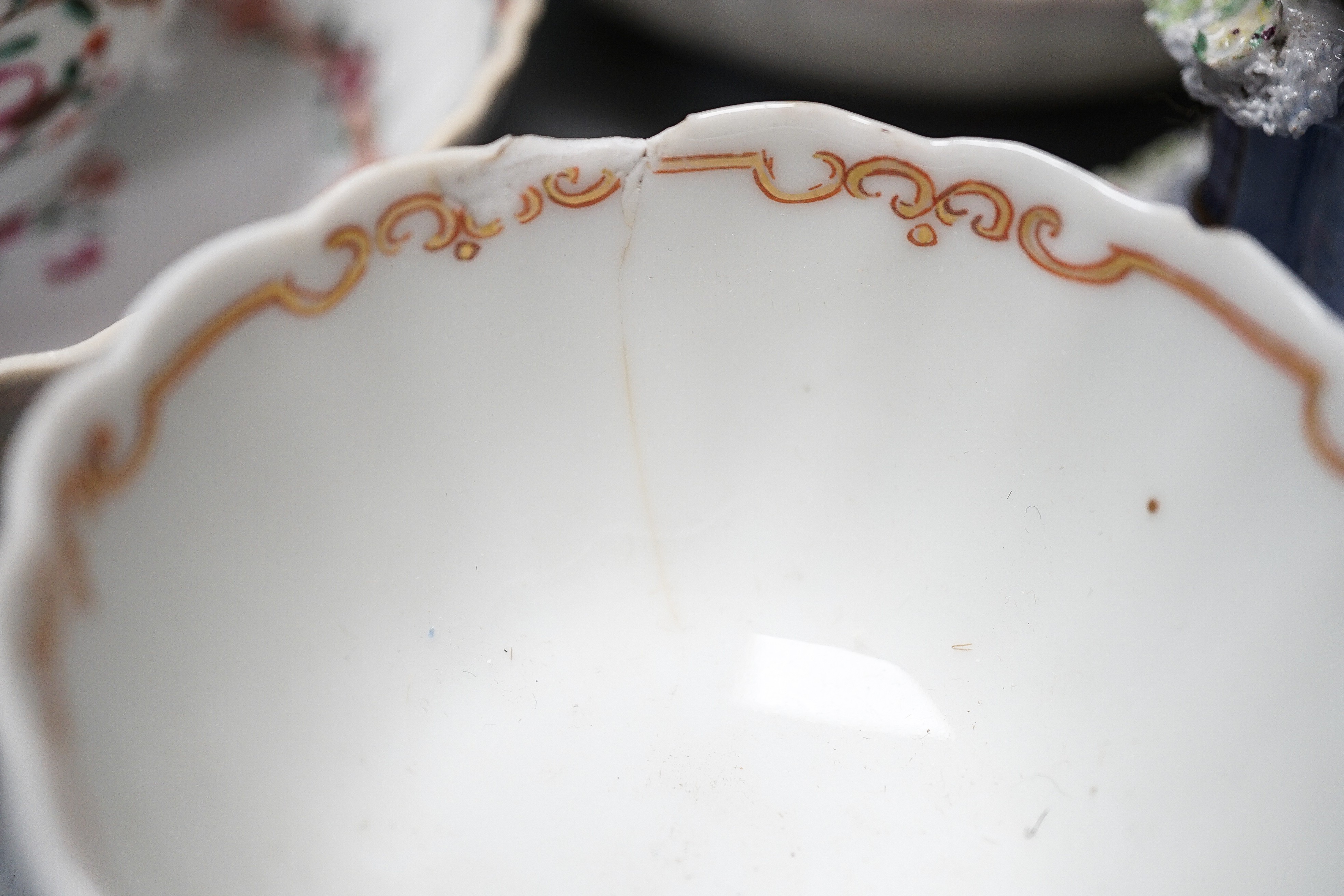 Three Chinese export famille rose tea bowls and two saucers, three Staffordshire porcelain cottage pastille burners and an English porcelain cream boat